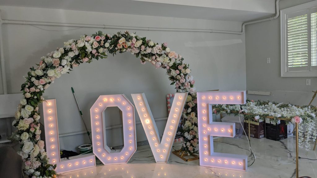 Rent Windsor marquee letters and a flower arch framing for events 