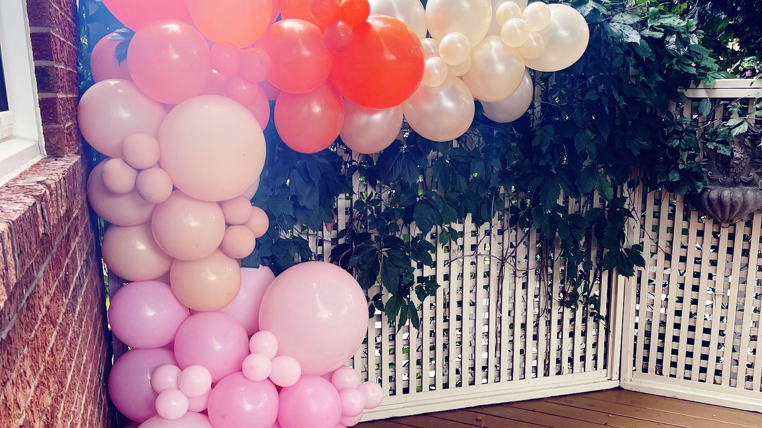 A balloon garland mixing large and small balloons along its length